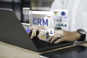 real estate agent using a CRM to automate tasks