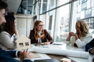 real estate team leader working with her agents